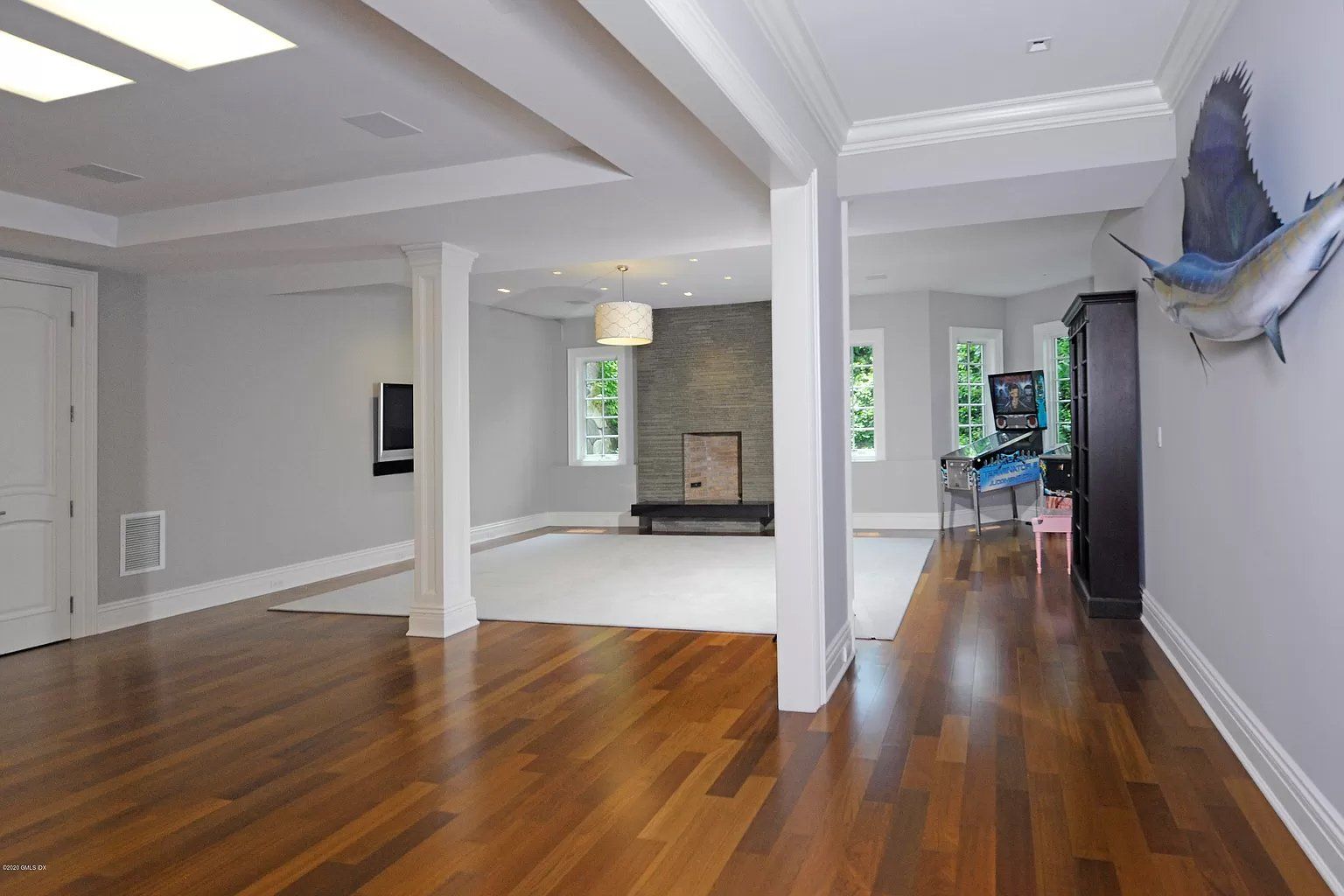 Hardwood flooring and white ceiling