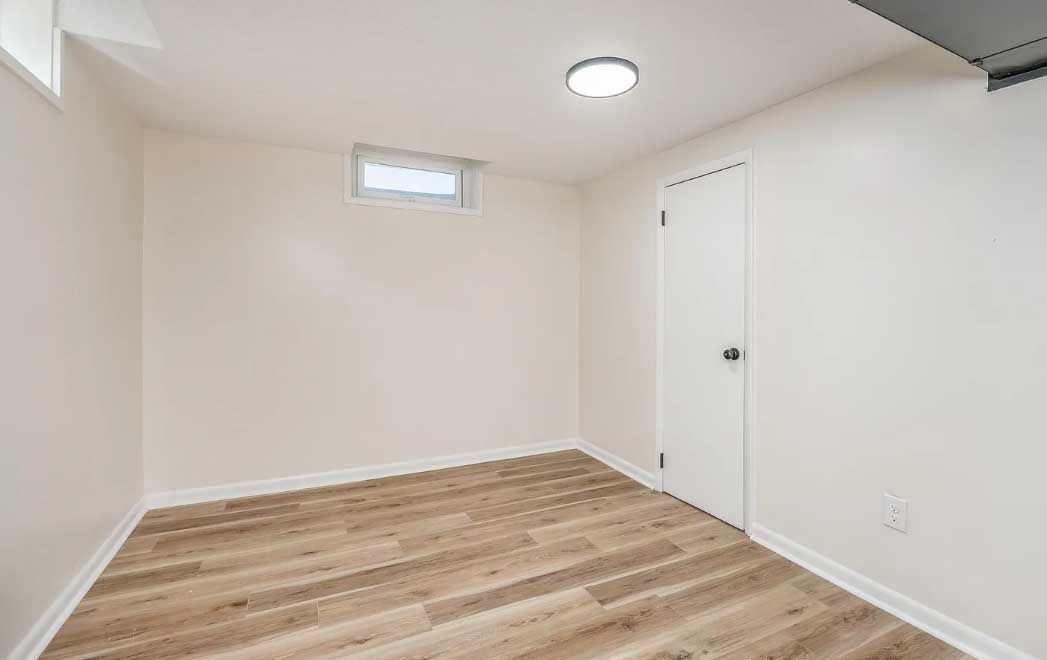 There is a window in the corner of the room.