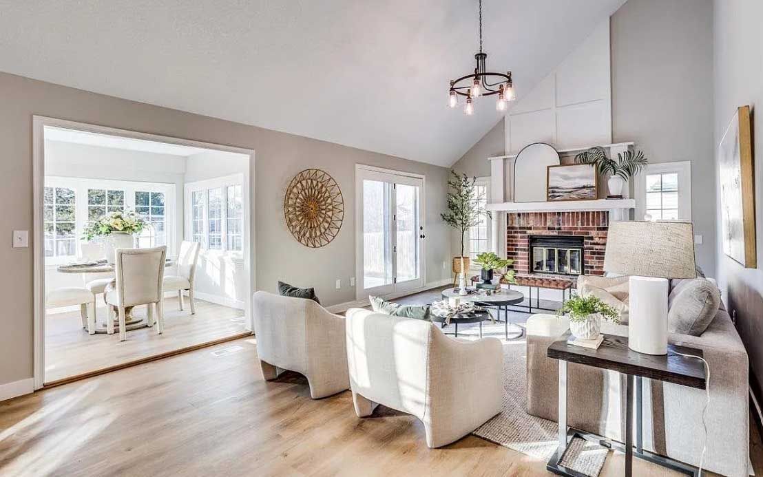 A living room filled with furniture and a fireplace.