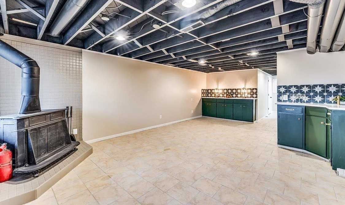 There is a fireplace in the middle of the room.