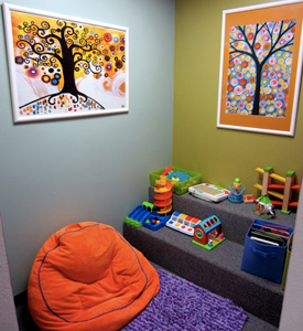 A room filled with toys and a bean bag chair