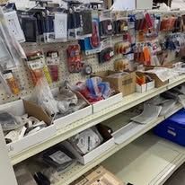 A store shelf filled with lots of different items.