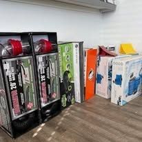 A bunch of boxes sitting on top of a wooden table.