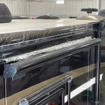 A close up of a piano in a garage.