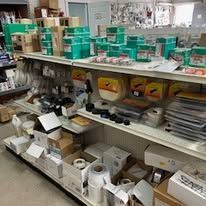 A store shelf filled with lots of boxes and containers.