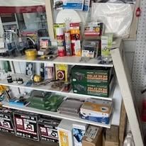 A shelf filled with lots of items in a store.