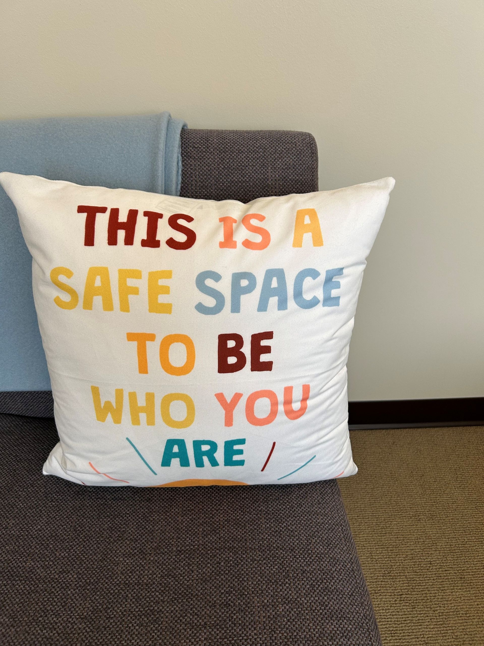 A pillow that says this is a safe space to be who you are.