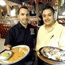 Two men showing Food