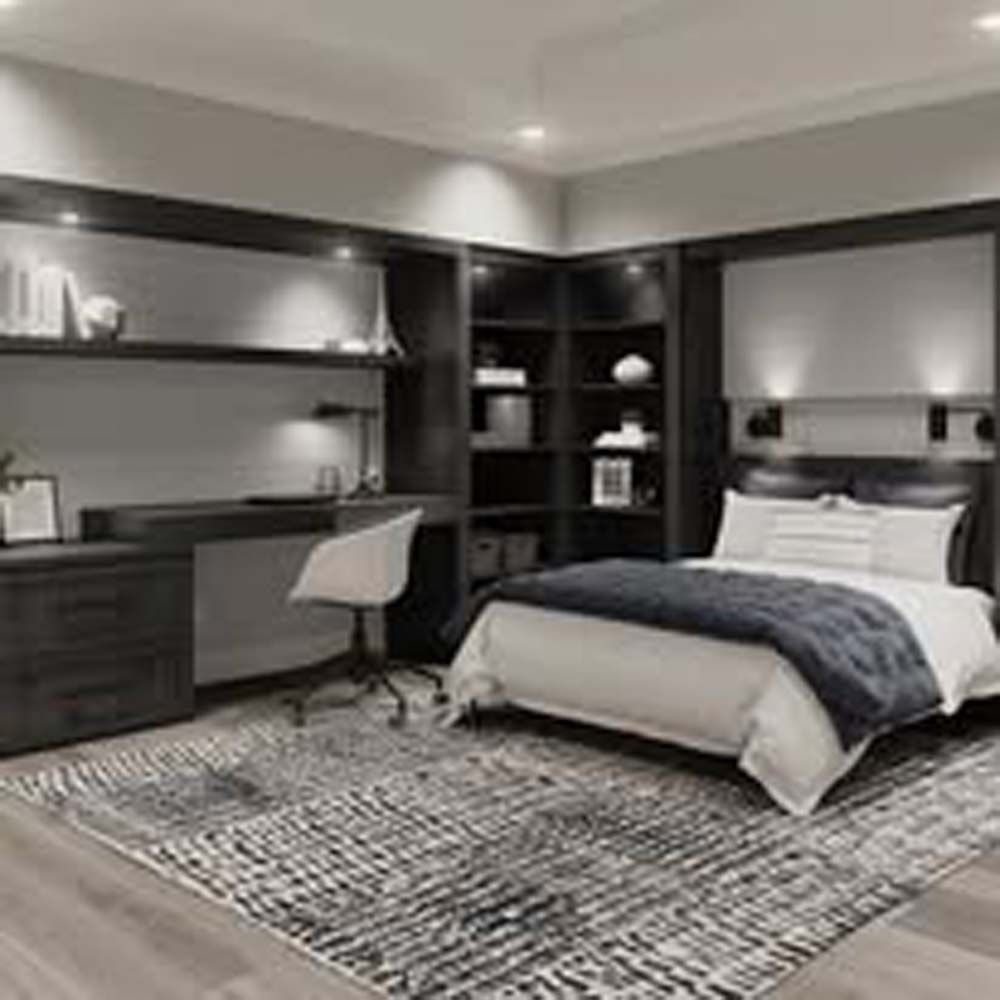 Modern bedroom with desk, bed, rug, and dark wood built-ins.