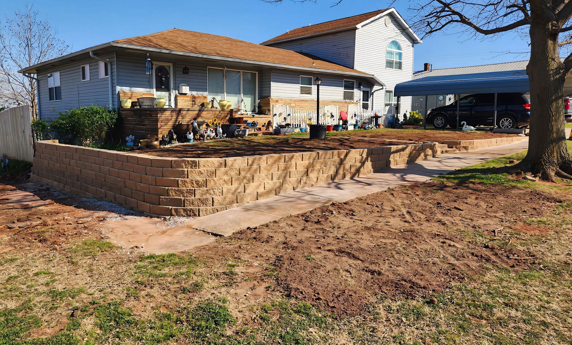 A house with a curved retaining wall