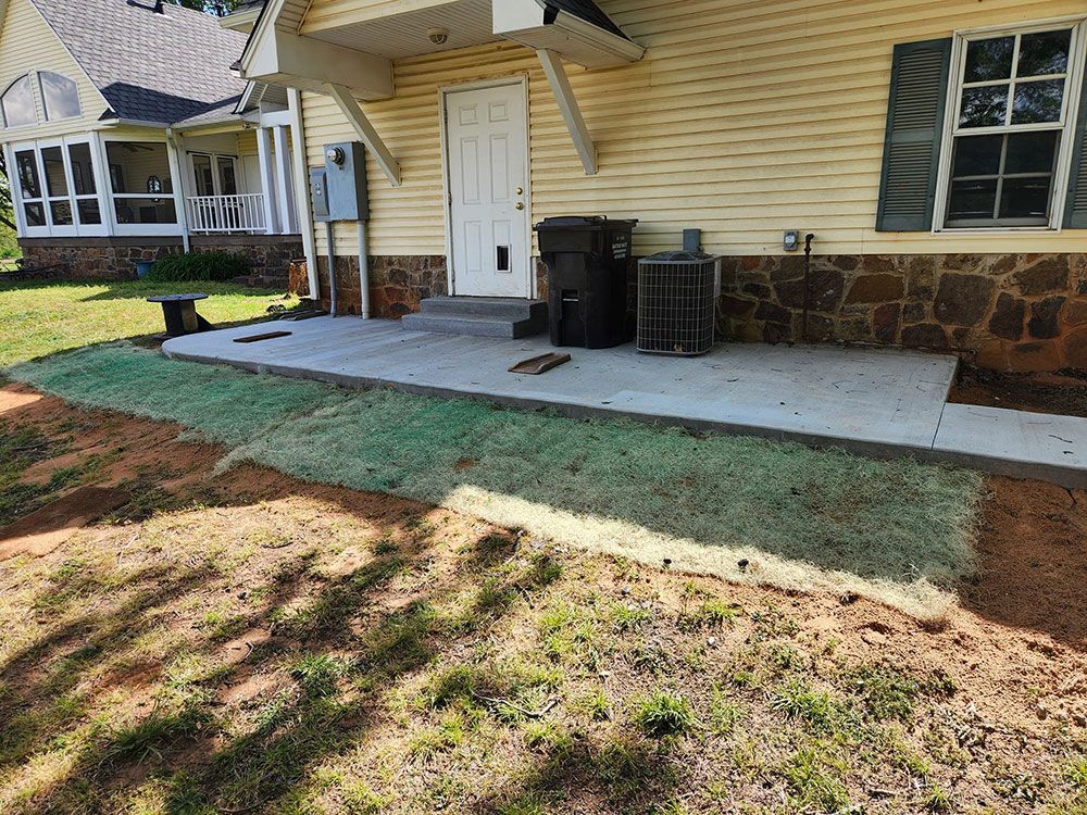 A house with a concrete patio in front