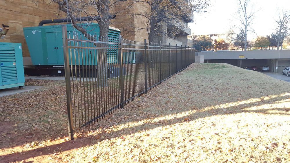 A metal fence in front of a building