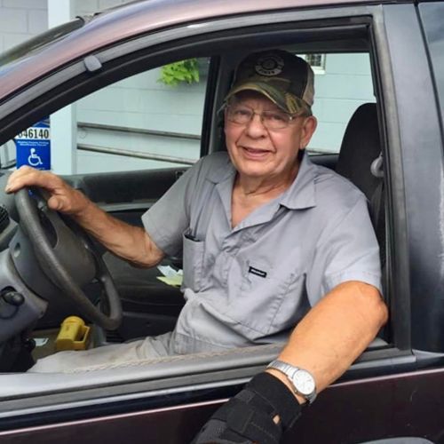 A man is sitting in a car