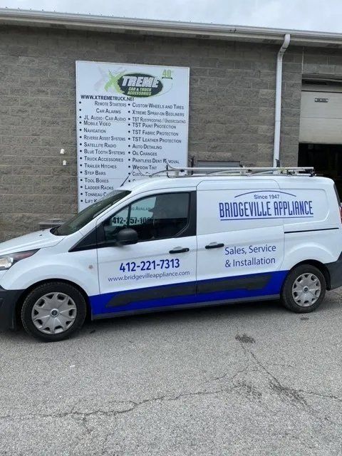 Van with vinyl sticker logo