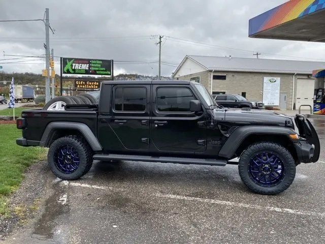 Black pick up truck with dark blue mags