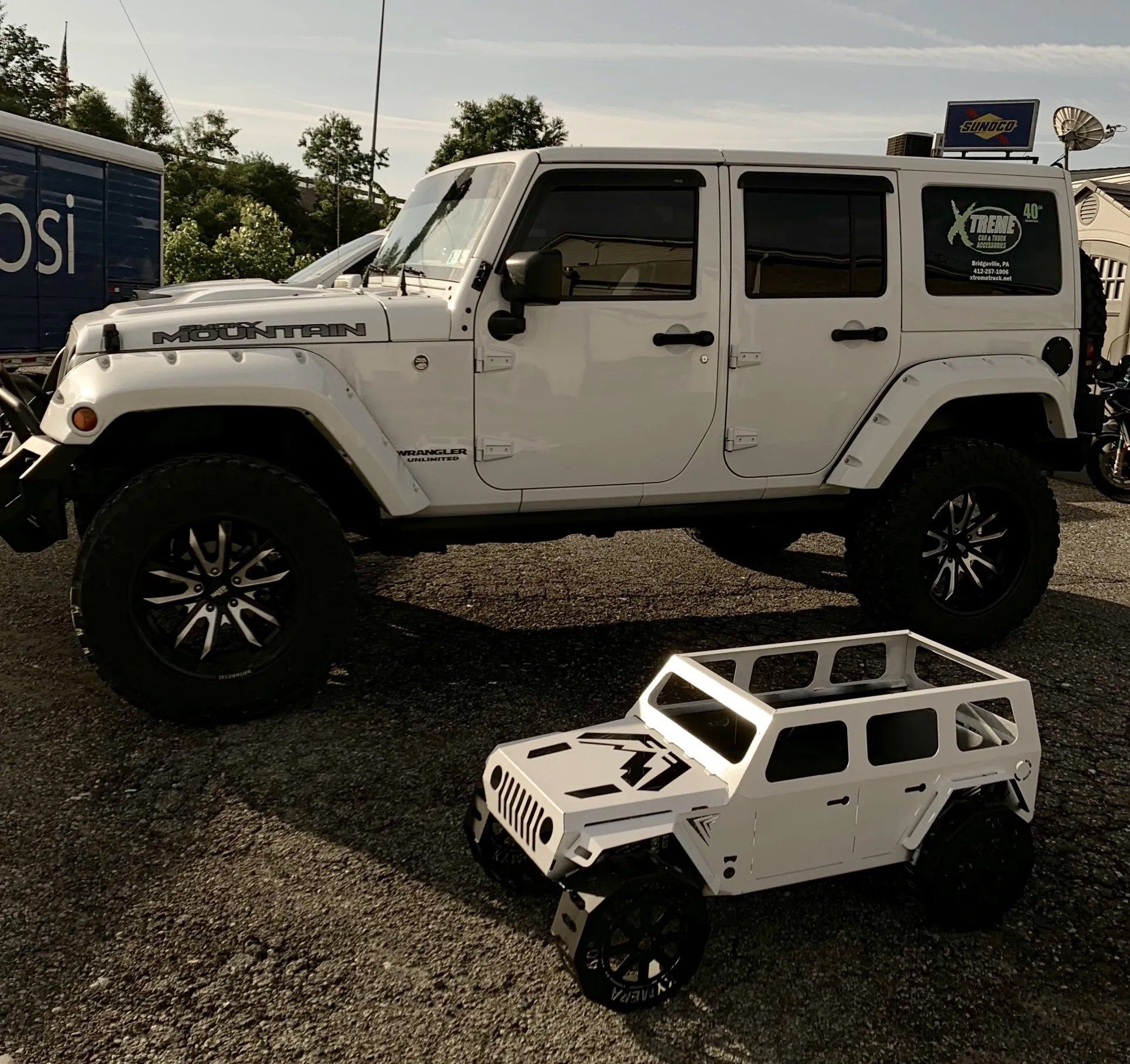 White truck and toy truck