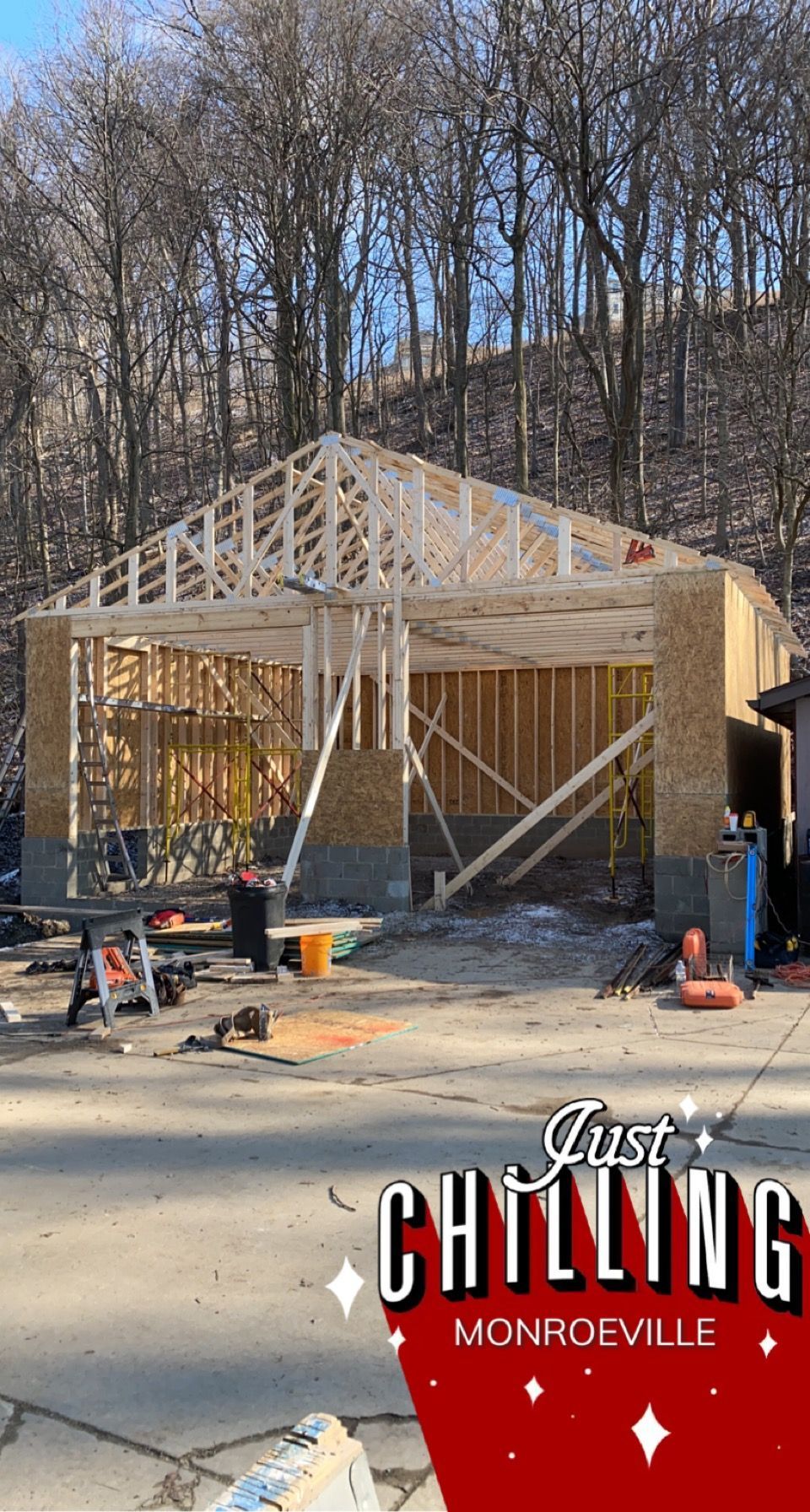 Garage under construction in Monroeville, with wooden framework and walls.