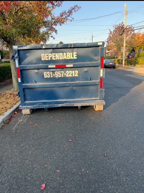 Blue dumpster labeled 