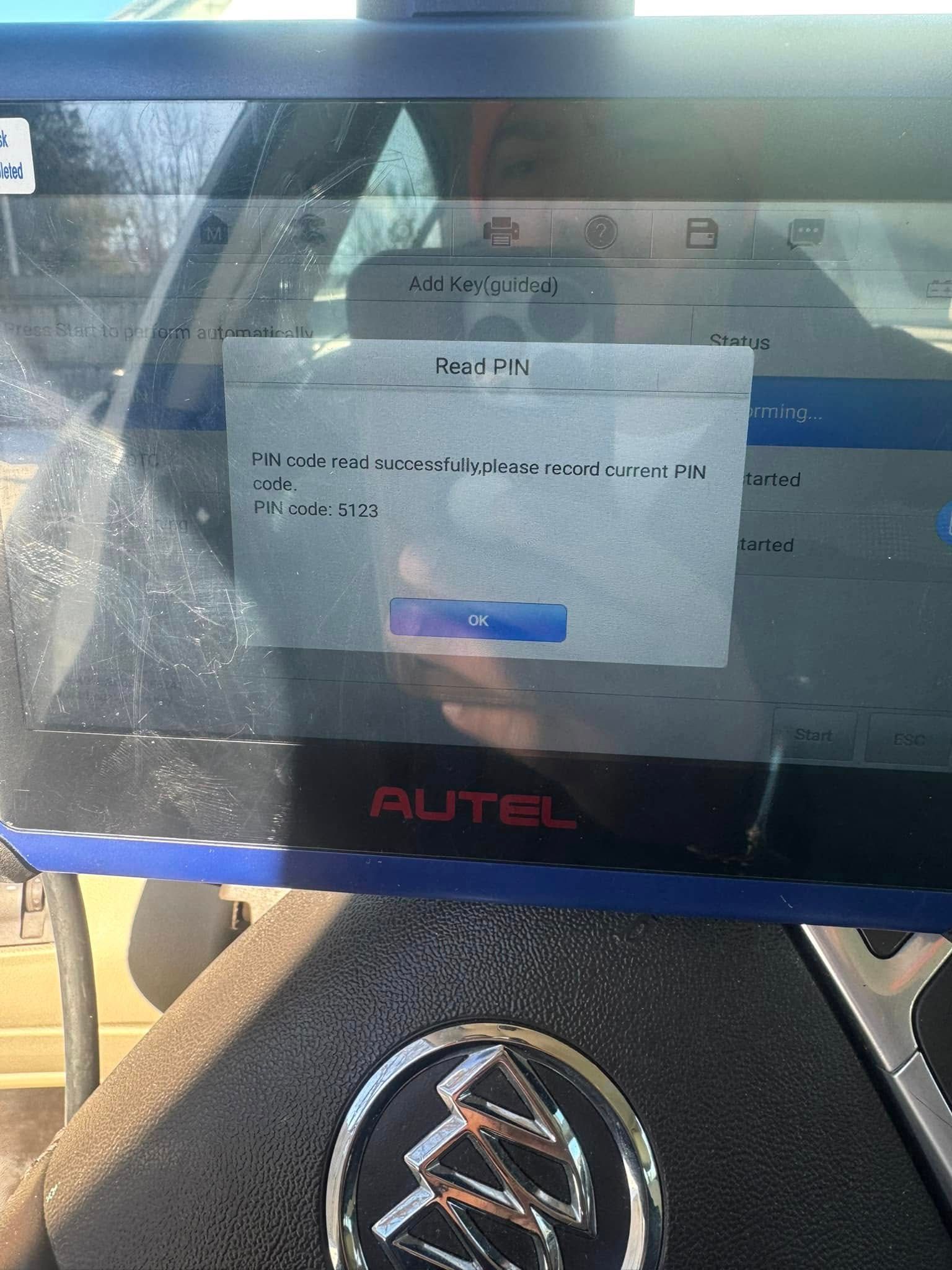 Autel diagnostic tablet showing a pop-up message on a car dashboard, with a Maserati logo below.