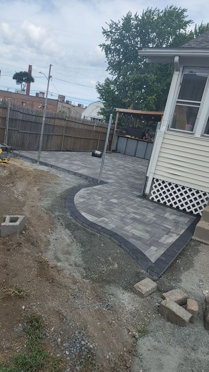 A patio is being built in the backyard