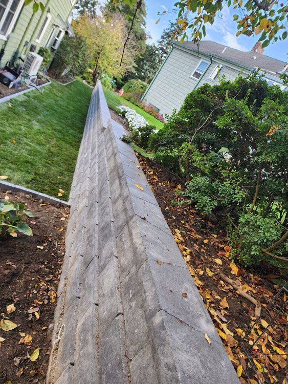 A stone wall in a yard 