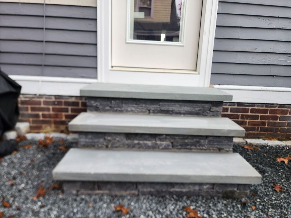 Stairs leading up to the front door of a house