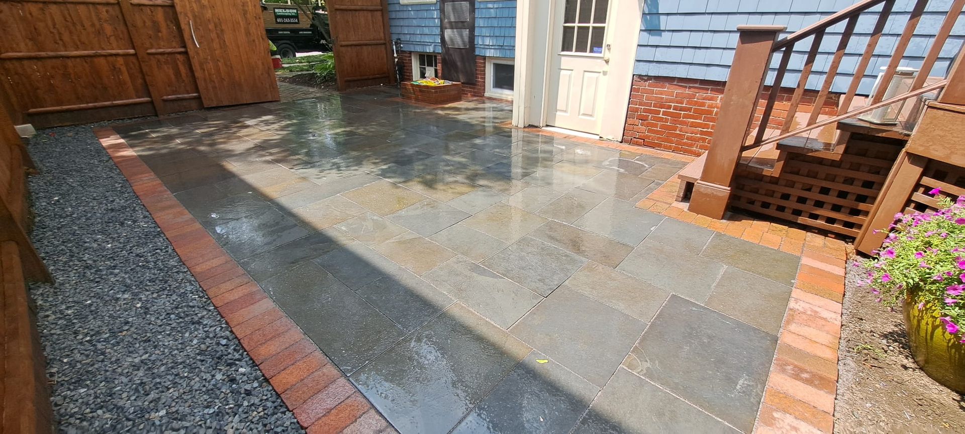 A patio with bricks and gravel