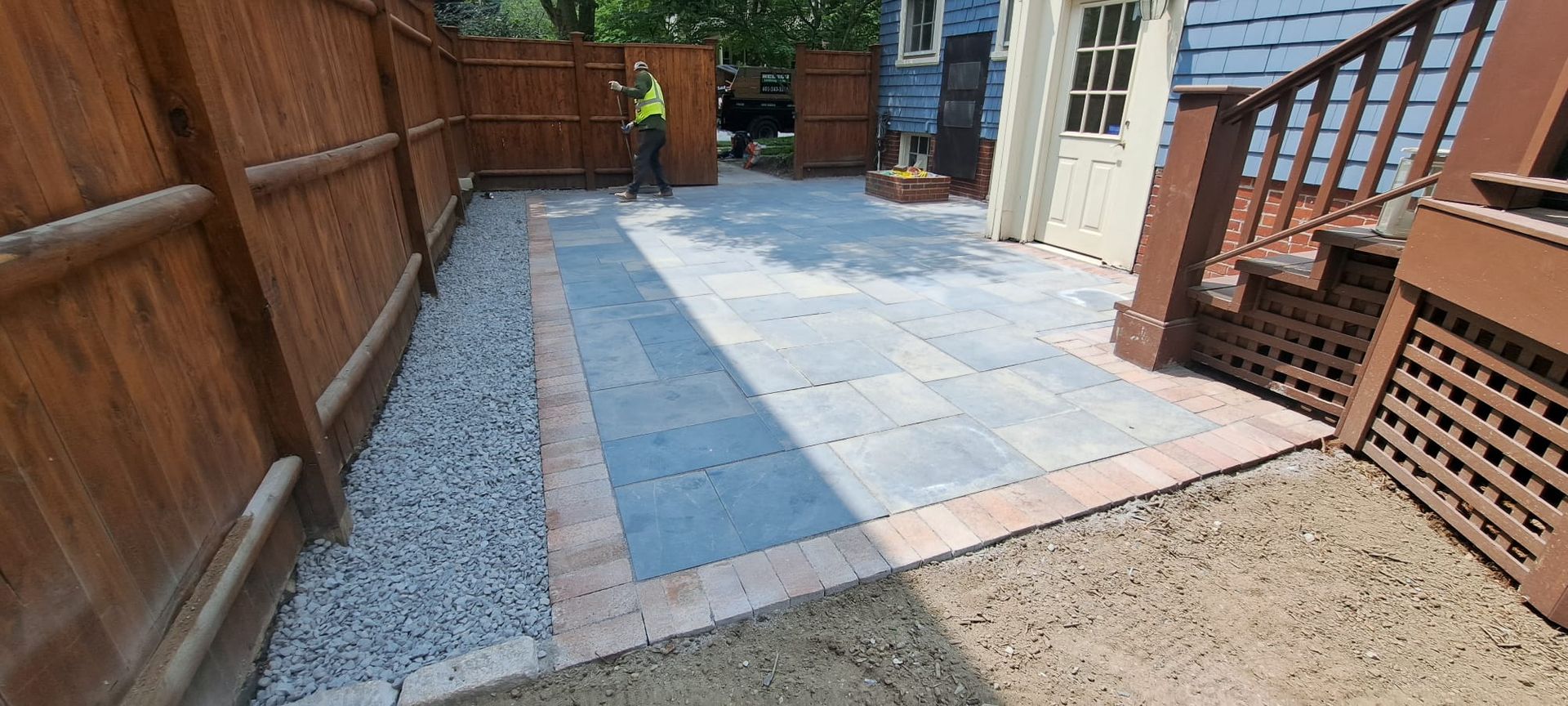 A patio with a wooden fence