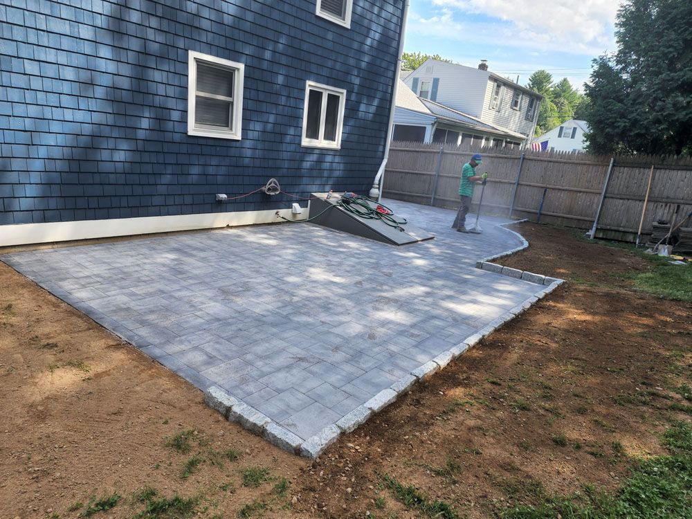 A man is standing on a patio 
