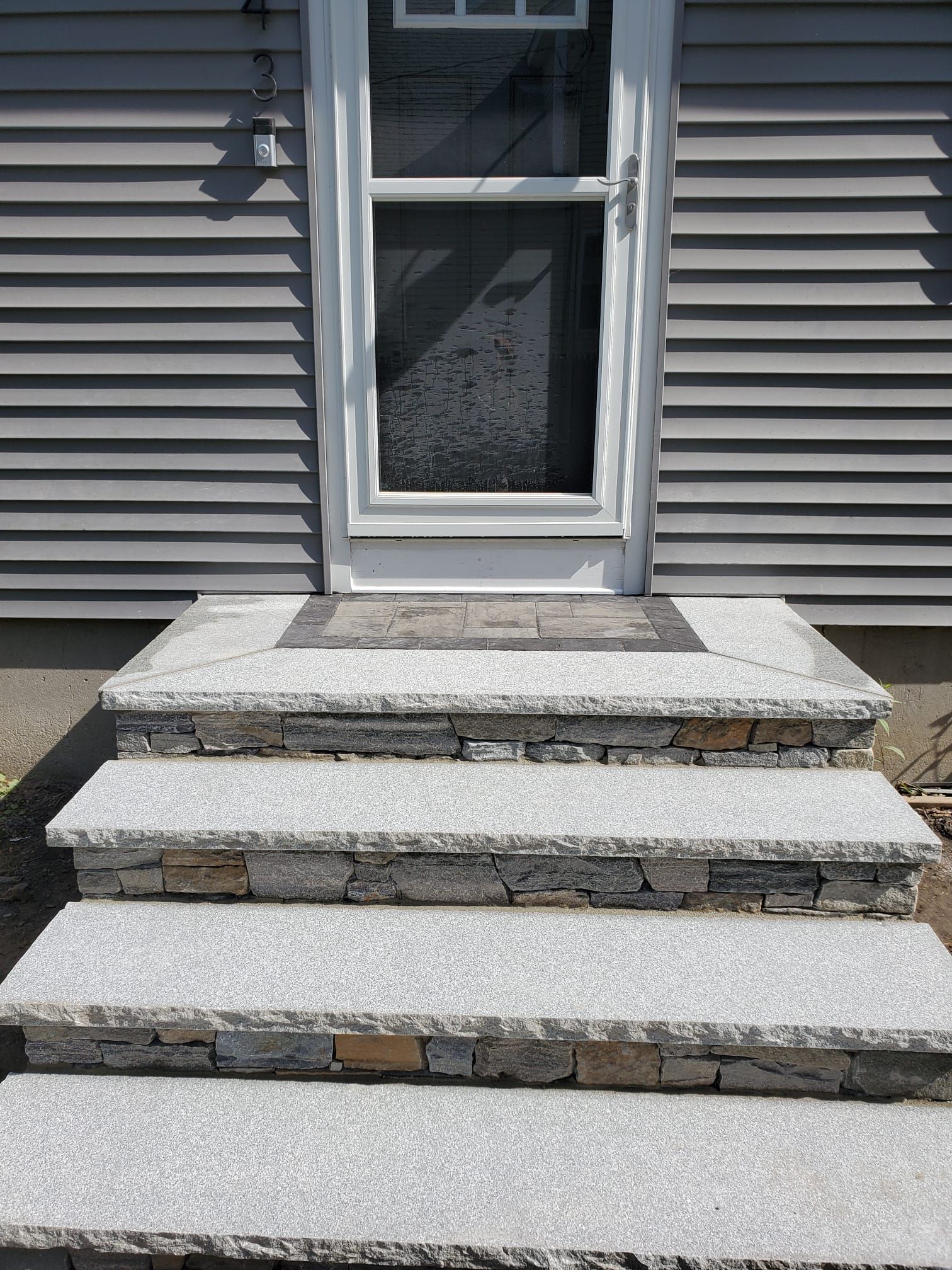 Stone steps leading up to the door  of a house