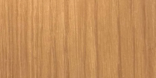 Close-up of light brown wood grain with vertical lines.
