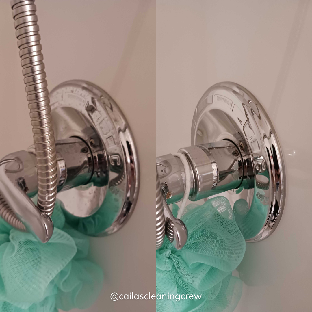 A shower head with a green sponge attached to it