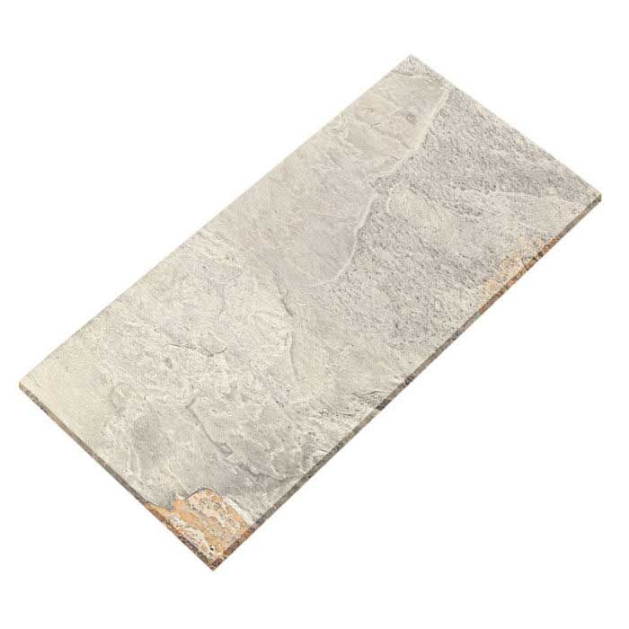 A gray tile with a brown border is laying on a white surface.