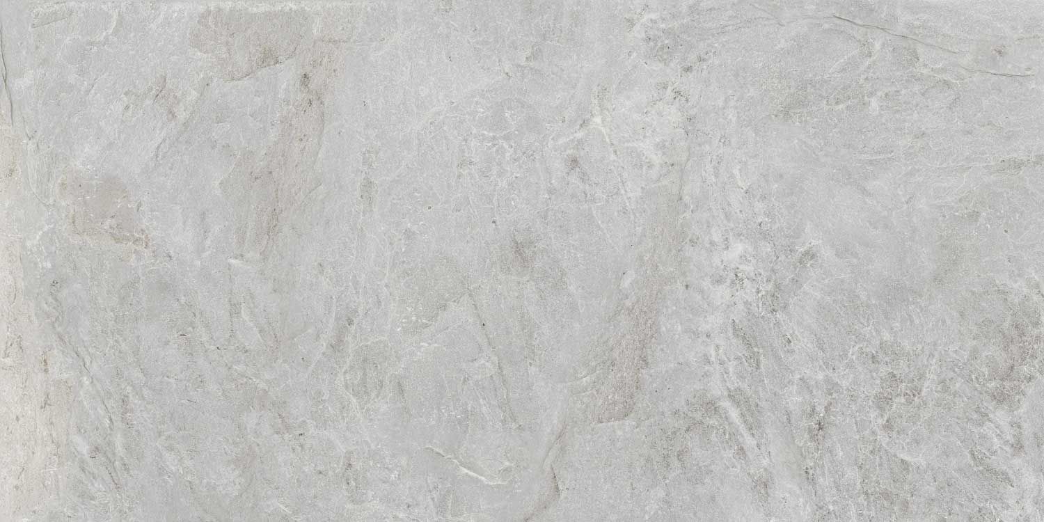 A close up of a white tile with a marble texture.