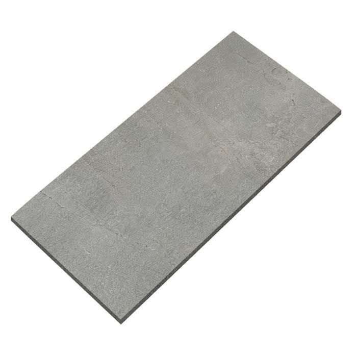A gray tile is laying on a white surface