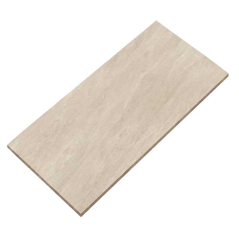 A white tile that looks like wood is laying on a white surface.