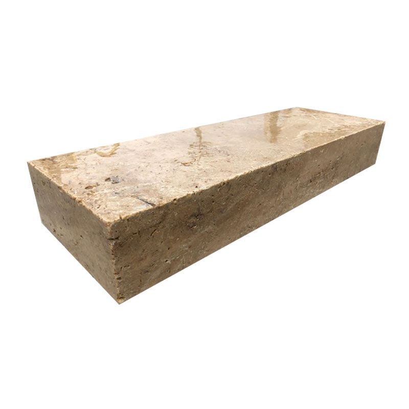 A brick is sitting on a white surface.