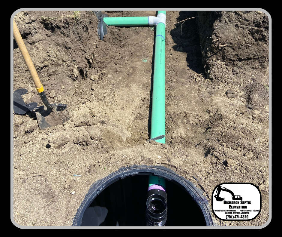 A green pipe is sitting in the dirt next to a shovel.