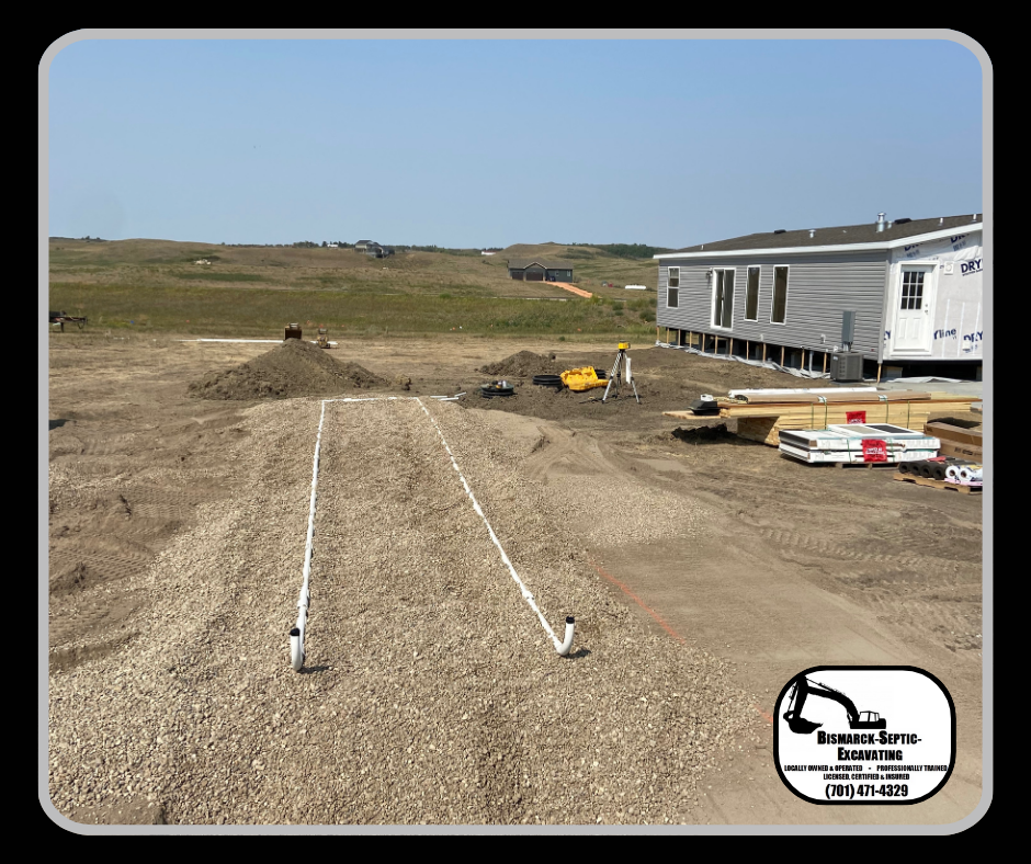 A house is being built in the middle of a dirt field.