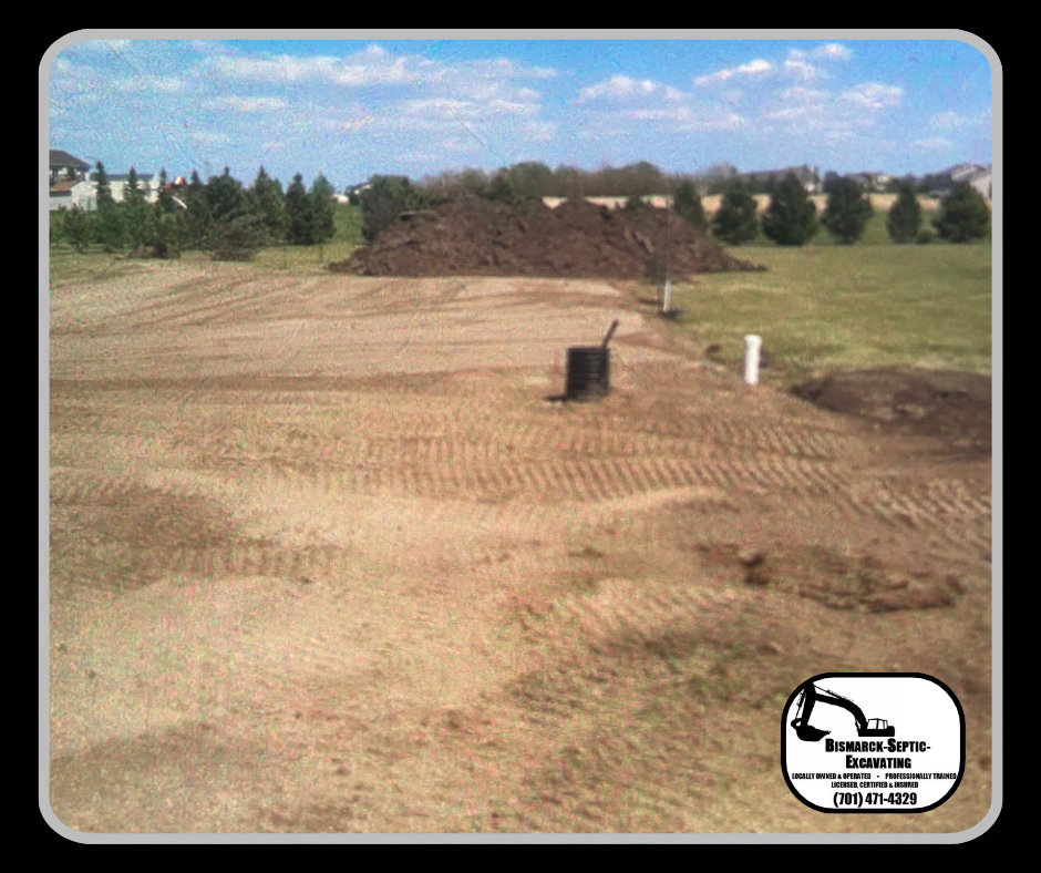 A large pile of dirt is in the middle of a field.