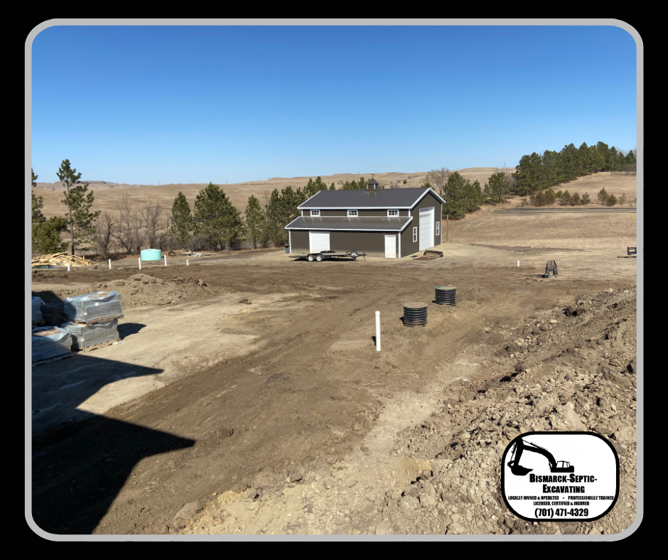 A house is being built in the middle of a dirt field.