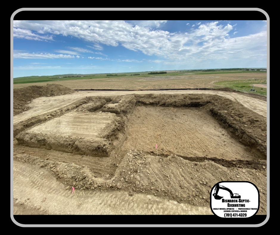 A large pile of dirt is sitting in the middle of a field.