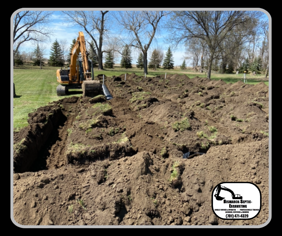 An excavator is digging a hole in the ground in a field.