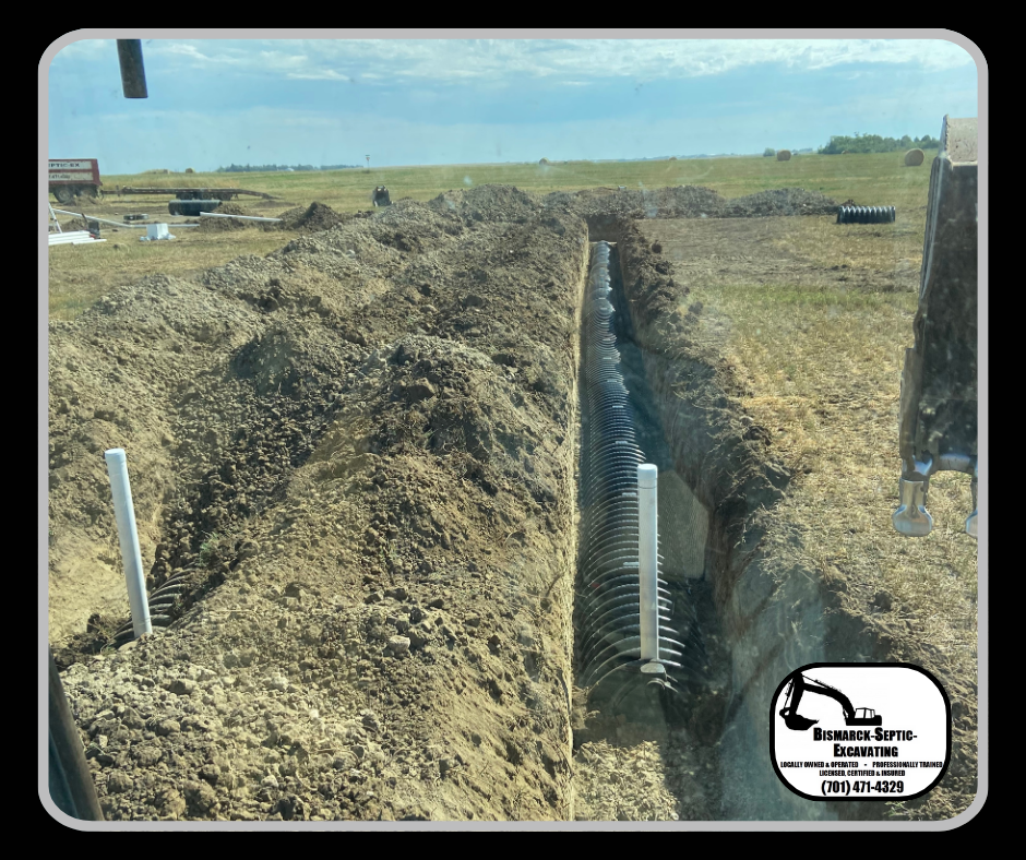 A picture of a trench in a field with a logo for a company.