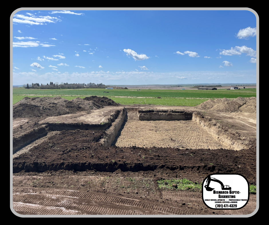 A large pile of dirt is sitting in the middle of a field.