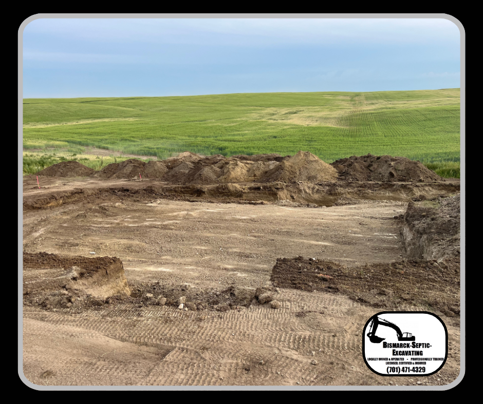 A large pile of dirt is sitting in the middle of a field.