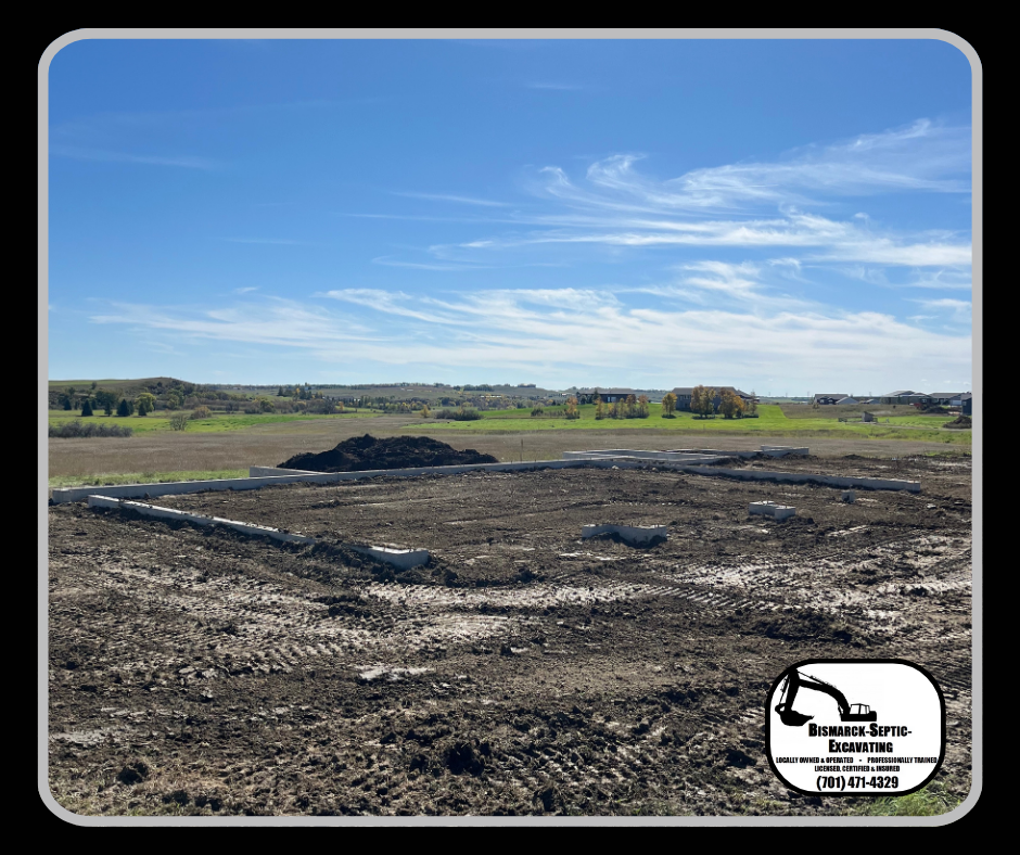A large dirt field with a blue sky in the background.