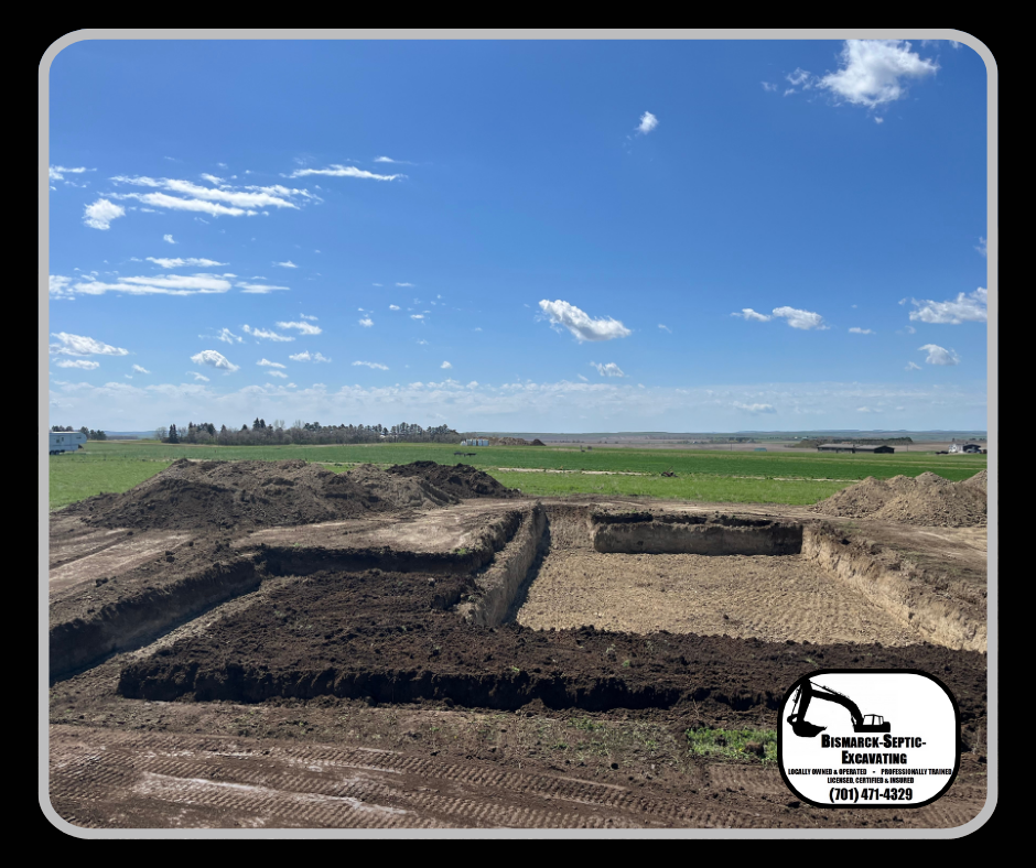 A large pile of dirt is sitting in the middle of a field.