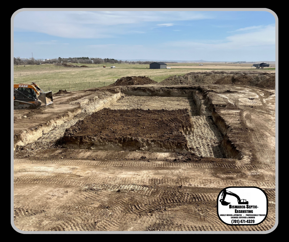 A large pile of dirt is being excavated in a field.