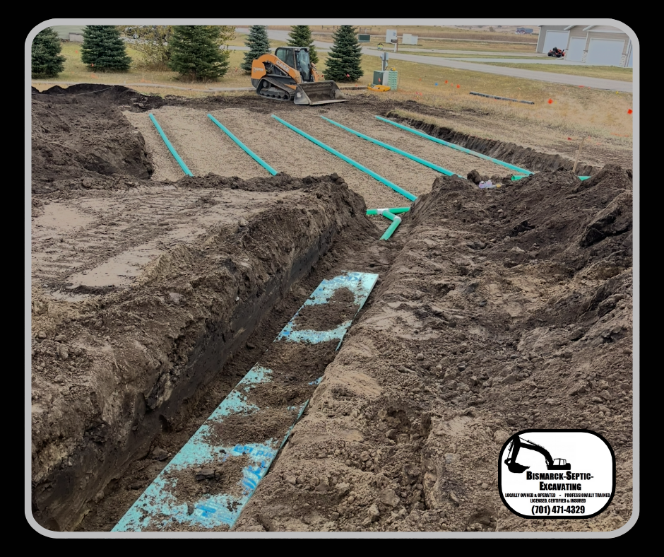 A picture of a septic system being installed in a dirt field.